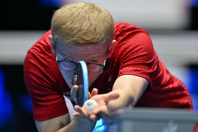 France's Felix Lebrun serves to China's Lin Shidong during their Men's Teams semi-final match at the ITTF World Table Tennis Championships in Wembley Arena, west London on May 9, 2026. (Photo by Glyn KIRK / AFP)