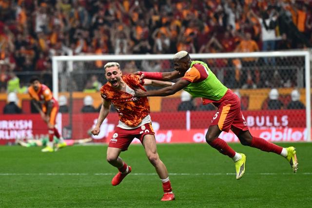 Galatasaray's Nigerian forward #45 Victor Osimhen and Galatasaray's Turkish forward #53 Baris Alper Yilmaz celebrates after winning the Turkish Super lig football match between Galatasaray and Antalyaspor, and the championship, at the Rams Park stadium in Istanbul, on May 9, 2026. Galatasaray clinched the Turkish Super Lig championship with one week remaining in the season. (Photo by Yasin AKGUL / AFP)