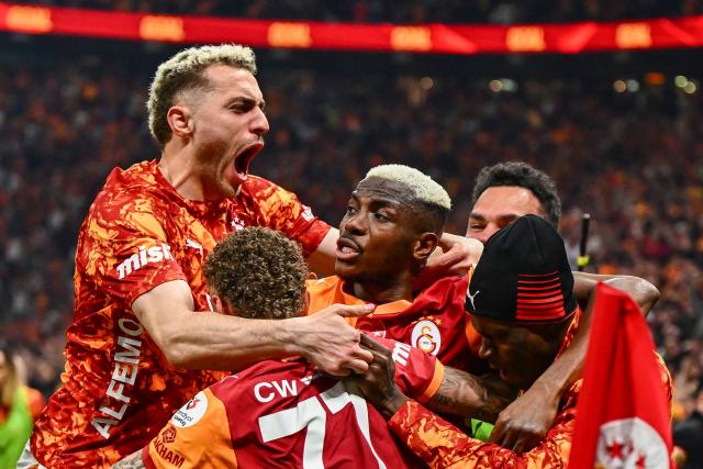 Galatasaray's Nigerian forward #45 Victor Osimhen (C) celebrates with teammates after scoring during the Turkish Super lig football match between Galatasaray and Antalyaspor at the Rams Park stadium in Istanbul, on May 9, 2026. Galatasaray clinched the Turkish Super Lig championship with one week remaining in the season. (Photo by Yasin AKGUL / AFP)