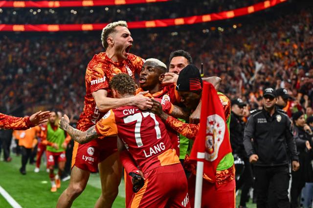 Galatasaray's Nigerian forward #45 Victor Osimhen (C) celebrates with teammates after scoring during the Turkish Super lig football match between Galatasaray and Antalyasporat the Rams Park stadium in Istanbul, on May 9, 2026. Galatasaray clinched the Turkish Super Lig championship with one week remaining in the season. (Photo by Yasin AKGUL / AFP)