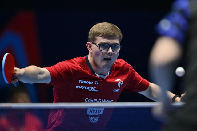 France's Alexis Lebrun returns to China's Liang Jingkun during their Men's Teams semi-final match at the ITTF World Table Tennis Championships in Wembley Arena, west London on May 9, 2026. (Photo by Glyn KIRK / AFP)