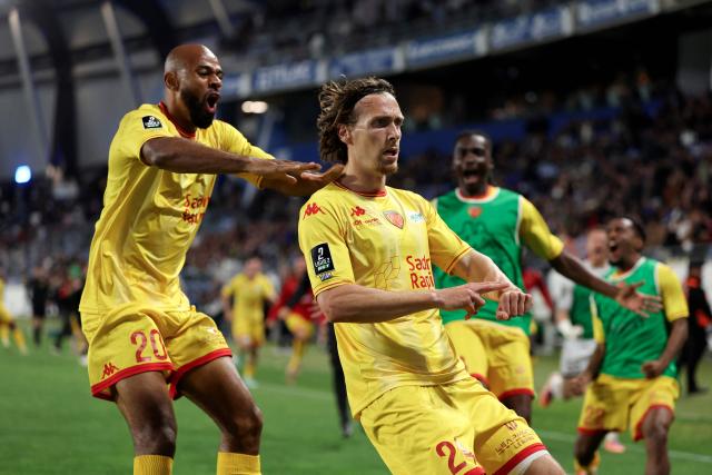 Le Mans' French midfielder #24 Milan Robin (R) celebrates after scoring a goal during the French L2 football match between Bastia and Le Mans at the Armand-Cesari stadium, in Bastia, on the French Mediterranean island of Corsica on May 9, 2026. Following Troyes' promotion as Ligue 2 champions, there is just one direct promotion spot left to be claimed by three clubs – Le Mans, Saint-Etienne and Red Star – on the 34th and final matchday in the evening of May 9, 2026. (Photo by Pascal POCHARD-CASABIANCA / AFP)