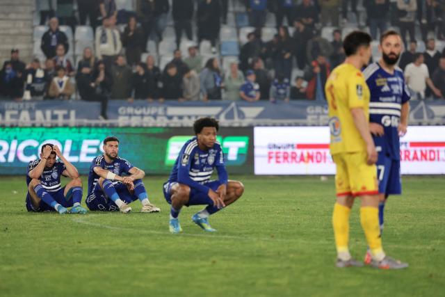 Bastia's players react at the end of the French L2 football match between Bastia and Le Mans at the Armand-Cesari stadium, in Bastia, on the French Mediterranean island of Corsica on May 9, 2026. Following Troyes' promotion as Ligue 2 champions, there is just one direct promotion spot left to be claimed by three clubs – Le Mans, Saint-Etienne and Red Star – on the 34th and final matchday in the evening of May 9, 2026. (Photo by Pascal POCHARD-CASABIANCA / AFP)