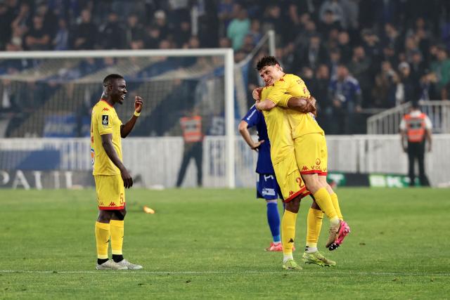 Le Mans' players celebrate at the end of the French L2 football match between Bastia and Le Mans at the Armand-Cesari stadium, in Bastia, on the French Mediterranean island of Corsica on May 9, 2026. Following Troyes' promotion as Ligue 2 champions, there is just one direct promotion spot left to be claimed by three clubs – Le Mans, Saint-Etienne and Red Star – on the 34th and final matchday in the evening of May 9, 2026. (Photo by Pascal POCHARD-CASABIANCA / AFP)