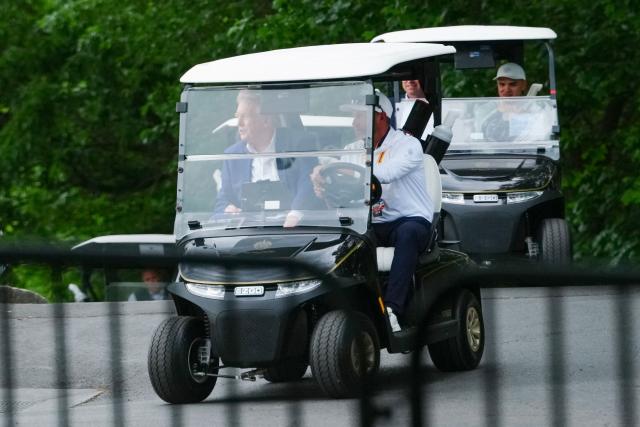 US President Donald Trump rides a golf cart as he departs LIV Golf Virginia 2026 tournament at Trump National Golf Club in Sterling, Virginia on May 9, 2026. (Photo by Aaron Schwartz / AFP)