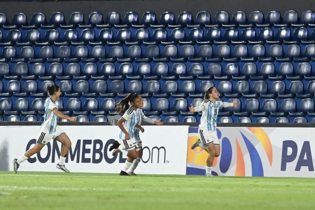 Argentina's forward #09 Mercedes Diz (R) celebrates scoring her team's first goal during the Conmebol Women U-17 final football match between Brazil and Argentina at the Defensores del Chaco stadium in Asuncion on May 9, 2026. (Photo by DANIEL DUARTE / AFP)