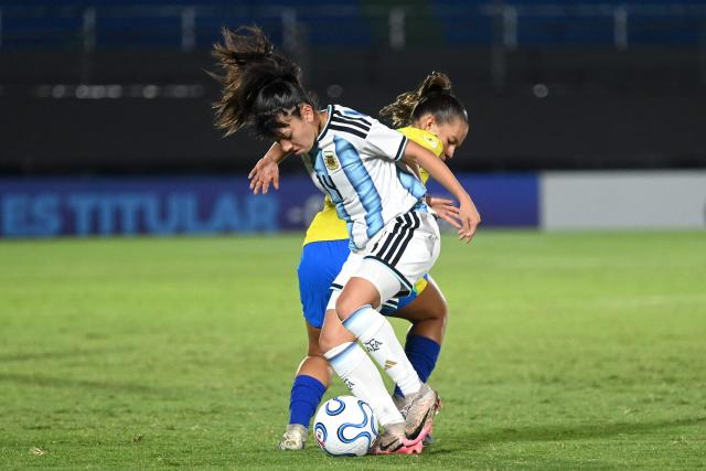 Argentina's midfielder #14 Mia Gamarra (L) and Brazil's midfielder #21 Leticia Pinho (R) fight for the ball during the Conmebol Women U-17 final football match between Brazil and Argentina at the Defensores del Chaco stadium in Asuncion on May 9, 2026. (Photo by DANIEL DUARTE / AFP)
