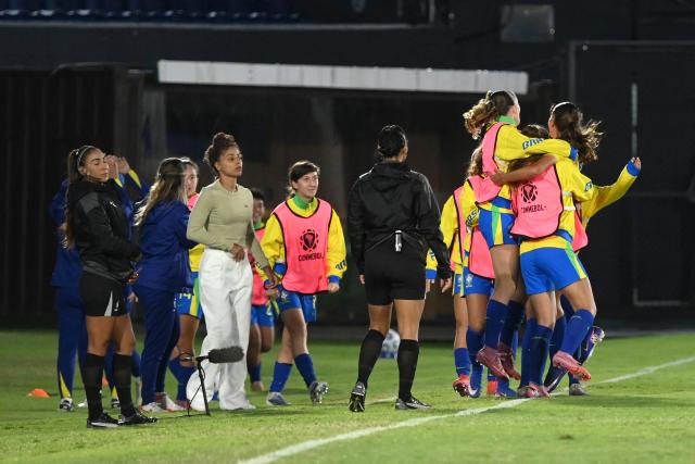 Brazil's midfielder #11 Sofia Gamonal (unseen) celebrates with teammates after scoring her team's first goal during the Conmebol Women U-17 final football match between Brazil and Argentina at the Defensores del Chaco stadium in Asuncion on May 9, 2026. (Photo by DANIEL DUARTE / AFP)
