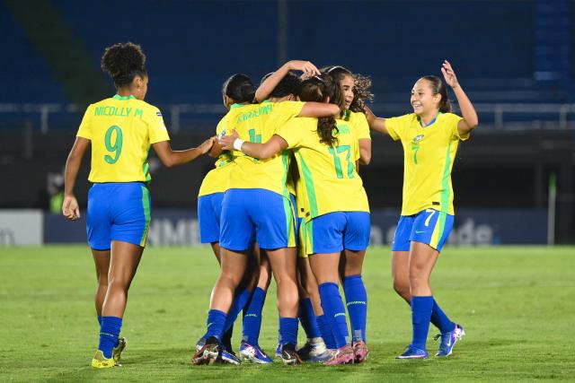 Brazil's midfielder #11 Sofia Gamonal (unseen) celebrates with teammates after scoring her team's first goal during the Conmebol Women U-17 final football match between Brazil and Argentina at the Defensores del Chaco stadium in Asuncion on May 9, 2026. (Photo by DANIEL DUARTE / AFP)