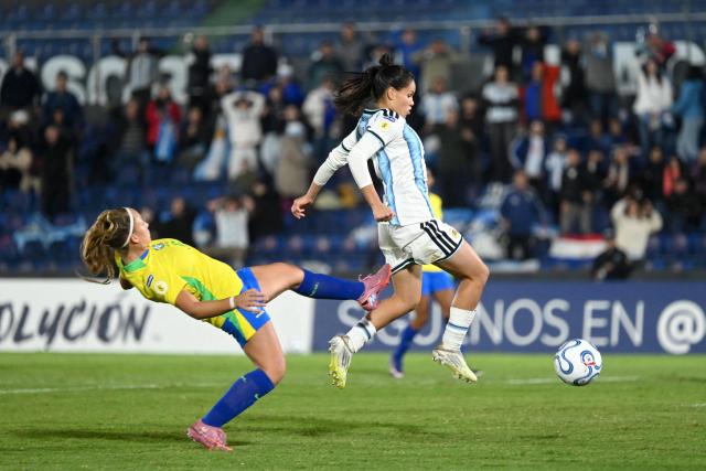Brazil's defender #06 Isadora Rech (L) and Argentina's forward #07 Julieta Aguilar (R) fight for the ball during the Conmebol Women U-17 final football match between Brazil and Argentina at the Defensores del Chaco stadium in Asuncion on May 9, 2026. (Photo by DANIEL DUARTE / AFP)