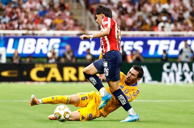 Guadalajara's midfielder #226 Santiago Sandoval and Tigres' midfielder #06 Juan Pablo Vigon fight for the ball during the Liga MX Clausura quarter-finals second leg football match between Guadalajara and Tigres at Akron Stadium in Guadalajara, Jalisco state, Mexico on May 9, 2026. (Photo by ULISES RUIZ / AFP)