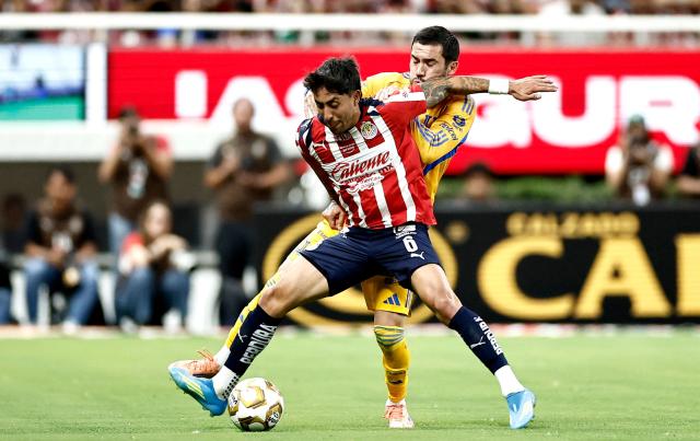 Guadalajara's midfielder #06 Omar Govea (front) and Tigres' midfielder #06 Juan Pablo Vigon fight for the ball during the Liga MX Clausura quarter-finals second leg football match between Guadalajara and Tigres at Akron Stadium in Guadalajara, Jalisco state, Mexico on May 9, 2026. (Photo by Ulises Ruiz / AFP)