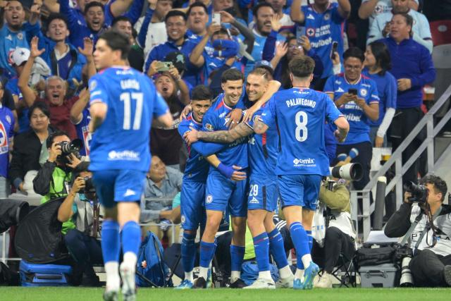 Cruz Azul's Argentine forward #20 Jose Paradela (C) celebrates with teammates after scoring his team's first goal during the Liga MX Clausura quarter-finals second leg football match between Cruz Azul and Atlas at Banorte Stadium in Mexico City on May 9, 2026. (Photo by Alfredo ESTRELLA / AFP)
