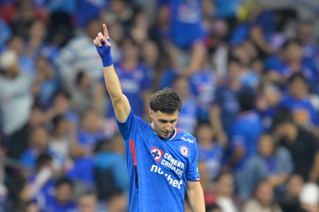 Cruz Azul's Argentine forward #20 Jose Paradela celebrates scoring his team's first goal during the Liga MX Clausura quarter-finals second leg football match between Cruz Azul and Atlas at Banorte Stadium in Mexico City on May 9, 2026. (Photo by Alfredo ESTRELLA / AFP)