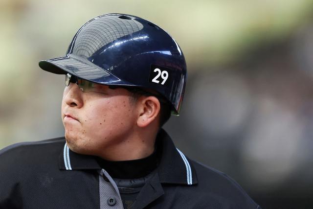 This picture taken on May 9, 2026 shows a Japanese professional baseball umpire wearing the number 29 on his helmet in solidarity with his colleague Takuto Kawakami who is still unconscious three weeks after being hit on the head by a bat, during a baseball game between Saitama Seibu Lions and Tohoku Rakuten Golden Eagles in Saitama. Umpires in the six professional games in Japan wore the number 29 on their headgear on May 9, 2026 to pray for Kawakami's recovery. (Photo by JIJI Press / AFP) / Japan OUT