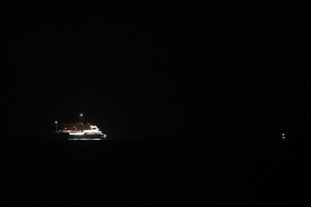 The Dutch-flagged hantavirus-stricken cruise ship MV Hondius sails near El Medano, Tenerife, in the Canary Islands, Spain early on May 10, 2026. A cruise ship hit with a deadly hantavirus outbreak is headed for Spain's Canary Islands, where most of the nearly 150 people on board will be evacuated and flown home after weeks at sea. The Dutch-flagged MV Hondius is expected to reach waters off the industrial port of Granadilla de Abona in Tenerife at dawn on May 10, 2026, where WHO chief Tedros Adhanom Ghebreyesus is due to help coordinate the ship's evacuation. (Photo by Jorge GUERRERO / AFP)