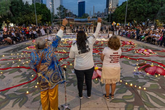 Mexican search collectives for missing persons hold a vigil at the Monument to the Mother in Mexico City on May 9, 2026, a day before the national march by the Mothers of the Disappeared on Mother's Day. (Photo by GERARDO MAGALLON / AFP)