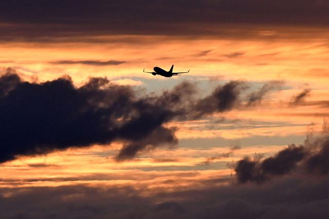 A photo taken on May 7, 2026 shows a Qantas Boeing 737 departing Melbourne's Tullamarine Airport. (Photo by William WEST / AFP)