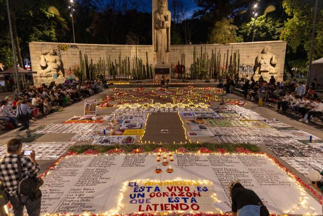 Mexican search collectives for missing persons hold a vigil at the Monument to the Mother in Mexico City on May 9, 2026, a day before the national march by the Mothers of the Disappeared on Mother's Day. (Photo by GERARDO MAGALLON / AFP)
