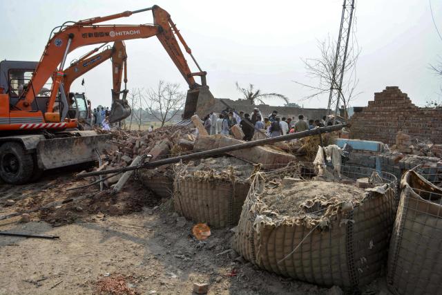 Excavators clear rubble from a damaged police checkpost following a car bombing attack by militants in Pakistan's Bannu on May 10, 2026. Militants detonated a car bomb at a checkpoint in northwestern Pakistan and opened fire on police, killing at least 12 and wounding five, officials said on May 10. (Photo by Karim ULLAH / AFP)