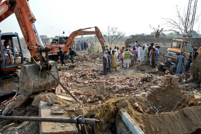 Excavators clear rubble from a damaged police checkpost following a car bombing attack by militants in Pakistan's Bannu on May 10, 2026. Militants detonated a car bomb at a checkpoint in northwestern Pakistan and opened fire on police, killing at least 12 and wounding five, officials said on May 10. (Photo by Karim ULLAH / AFP)
