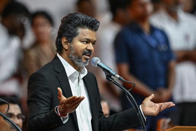 Newly elected chief minister of India's Tamil Nadu state, C. Joseph Vijay speaks after taking the oath during his swearing-in ceremony in Chennai on May 10, 2026. (Photo by R.Satish BABU / AFP)