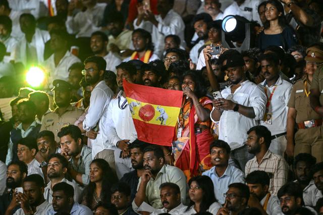 Supporters of the Tamilaga Vettri Kazhagam (TVK) party attend the swearing-in ceremony of the newly elected chief minister of India's Tamil Nadu state, C. Joseph Vijay, in Chennai on May 10, 2026. (Photo by R.Satish BABU / AFP)