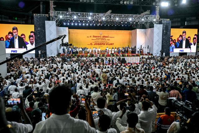 Supporters of the Tamilaga Vettri Kazhagam (TVK) party attend the swearing-in ceremony of the newly elected chief minister of India's Tamil Nadu state, C. Joseph Vijay, in Chennai on May 10, 2026. (Photo by R.Satish BABU / AFP)