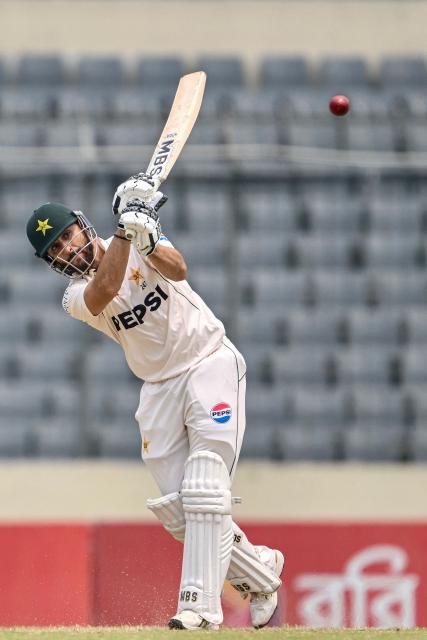 Pakistan's Salman Agha plays a shot during the third day of the first Test cricket match between Bangladesh and Pakistan at the Sher-e-Bangla National Stadium in Mirpur on May 10, 2026. (Photo by Munir UZ ZAMAN / AFP)