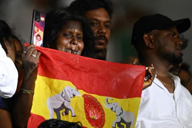 Supporters of the Tamilaga Vettri Kazhagam (TVK) party attend the swearing-in ceremony of the newly elected chief minister of India's Tamil Nadu state, C. Joseph Vijay, in Chennai on May 10, 2026. Indian film superstar C. Joseph Vijay was on May 10 sworn in as chief minister of Tamil Nadu state, after his party emerged as the single largest following elections in the industrial hub. (Photo by R.Satish BABU / AFP)