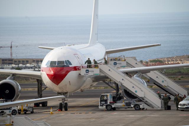 Crew members board the Spanish air force Airbus A310 plane at the Tenerife Sur-Reina Sofia airport as they prepare for the arrival of Spanish evacuees from the Dutch flagged hantavirus-stricken cruise ship MV Hondius which anchored at the industrial port of Granadilla de Abona on the island of Tenerife in Spain's Canary Islands on May 10, 2026. Repatriation flights for the nearly 150 passengers onboard the ship hit by a deadly hantavirus outbreak are planned to the United States, Britain, France,  and other countries, Spain's interior minister announced on Saturday. Most of the nearly 150 people on board will be transferred to shore on smaller vessels then by bus to the airport and then flown home after weeks at sea. (Photo by Antonio Sempere / AFP)