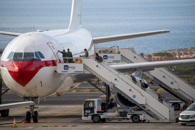 Crew members board the Spanish air force Airbus A310 plane at the Tenerife Sur-Reina Sofia airport as they prepare for the arrival of Spanish evacuees from the Dutch flagged hantavirus-stricken cruise ship MV Hondius which anchored at the industrial port of Granadilla de Abona on the island of Tenerife in Spain's Canary Islands on May 10, 2026. Repatriation flights for the nearly 150 passengers onboard the ship hit by a deadly hantavirus outbreak are planned to the United States, Britain, France,  and other countries, Spain's interior minister announced on Saturday. Most of the nearly 150 people on board will be transferred to shore on smaller vessels then by bus to the airport and then flown home after weeks at sea. (Photo by Antonio Sempere / AFP)