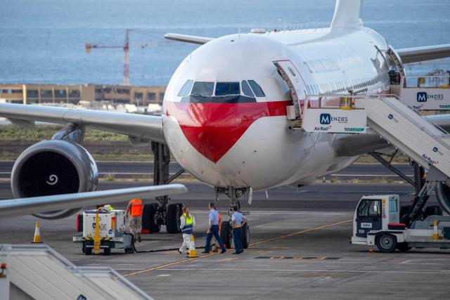 Crew members and personnel prepare the Spanish air force Airbus A310 plane at the Tenerife Sur-Reina Sofia airport as they await the arrival of Spanish evacuees from the Dutch flagged hantavirus-stricken cruise ship MV Hondius which anchored at the industrial port of Granadilla de Abona on the island of Tenerife in Spain's Canary Islands on May 10, 2026. Repatriation flights for the nearly 150 passengers onboard the ship hit by a deadly hantavirus outbreak are planned to the United States, Britain, France,  and other countries, Spain's interior minister announced on Saturday. Most of the nearly 150 people on board will be transferred to shore on smaller vessels then by bus to the airport and then flown home after weeks at sea. (Photo by Antonio Sempere / AFP)