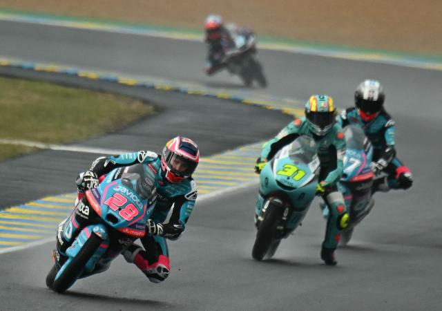 CF Moto Valresa Aspar Team's Spanish rider Maximo Quiles (L) leads Leopard Racing's Spanish rider Adrian Fernandez (C) and CF Moto Valresa Aspar Team's Argentinian rider Marco Morelli (R) during the Moto3 race as part of the Moto GP Grand Prix of France weekend at Le Mans, northwestern France, on May 10, 2026. (Photo by Loic VENANCE / AFP)