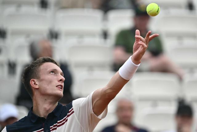 Czech Republic's Jiri Lehecka serves to Norway's Casper Ruud during the ATP Rome Open tennis tournament at Foro Italico in Rome on May 10, 2026. (Photo by Filippo MONTEFORTE / AFP)