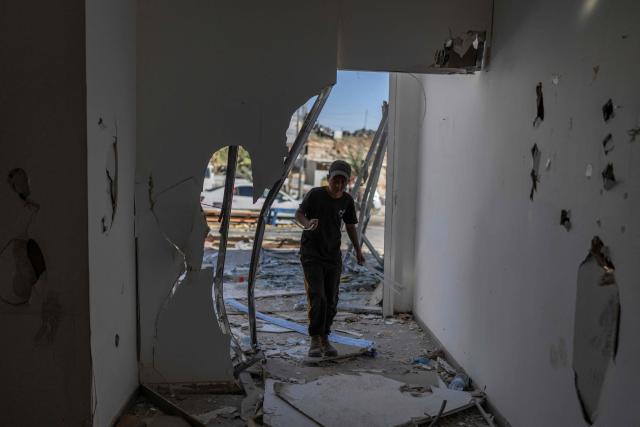 A Palestinian worker demolishes his shop, ahead of the arrival of an Israeli army demolition team, in the Israeli-occupied Palestinian West Bank town of al-Eizariya, bordering East Jerusalem on May 10, 2026. Israel has a policy of demolishing the homes of Palestinians accused of deadly attacks against Israelis, saying it acts as a deterrent, as well as structures that Israel says are built without a licence. (Photo by ilia YEFIMOVICH / AFP)