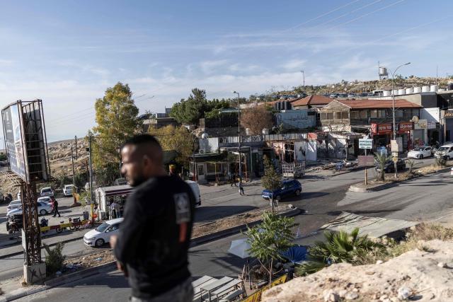 Vehicles drive past a string of shops demolished by their owners, ahead of the arrival of an Israeli army demolition team, in the Israeli-occupied Palestinian West Bank town of al-Eizariya, bordering East Jerusalem on May 10, 2026. Israel has a policy of demolishing the homes of Palestinians accused of deadly attacks against Israelis, saying it acts as a deterrent, as well as structures that Israel says are built without a licence. (Photo by ilia YEFIMOVICH / AFP)