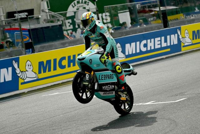 Leopard Racing's Spanish rider Adrian Fernandez celebrates as he crosses the finish line to take second place in the Moto3 race as part of the Moto GP Grand Prix of France weekend at Le Mans, northwestern France, on May 10, 2026. (Photo by Loic VENANCE / AFP)