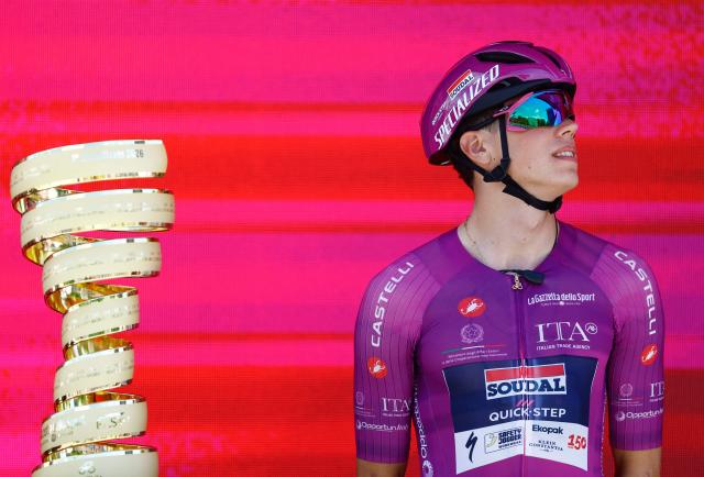 Soudal Quick-Step French rider Paul Magnier wearing the points classification mauve jersey (Maglia Ciclamino) looks on during the presentation of the teams prior the 3nd stage of the Giro d'Italia 2026 - Tour of Italy cycling race between Plovdiv and Sofia, Bulgaria, on May 10, 2026. (Photo by Luca Bettini / AFP)