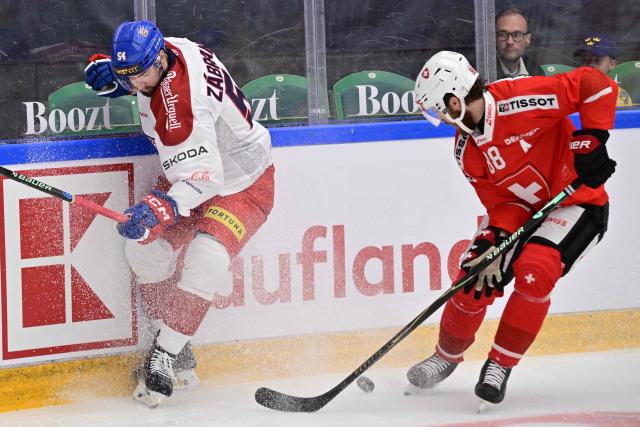 Czechia's Libor Zabransky (L) and Switzerland's Christoph Bertschy in action during the ice hockey Euro Hockey Tour (EHT) Beijer Hockey Games match between Switzerland and Czechia at Catena Arena in Angelholm, Sweden, on May 10, 2026. (Photo by Johan Nilsson/TT / TT News Agency / AFP) / Sweden OUT