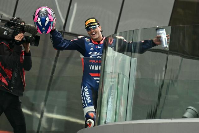 Blu Cru Pramac Yamaha Moto2's Spanish rider Izan Guevara celebrates on the podium after winning the Moto2 race as part of the Moto GP Grand Prix of France weekend at Le Mans, northwestern France, on May 10, 2026. (Photo by Loic VENANCE / AFP)
