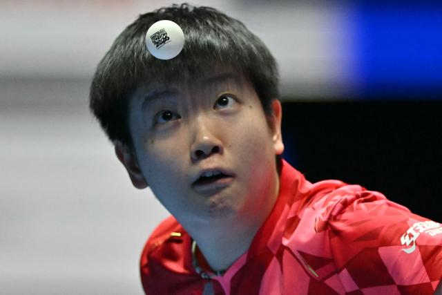 China's Sun Yingsha serves against Japan's Hina Hayata during their Women's Teams final match at the ITTF World Table Tennis Championships in Wembley Arena, west London on May 10, 2026. (Photo by Glyn KIRK / AFP)