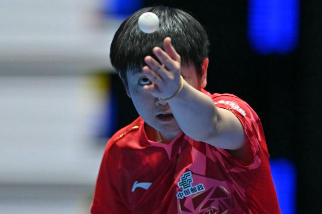 China's Sun Yingsha serves against Japan's Hina Hayata during their Women's Teams final match at the ITTF World Table Tennis Championships in Wembley Arena, west London on May 10, 2026. (Photo by Glyn KIRK / AFP)