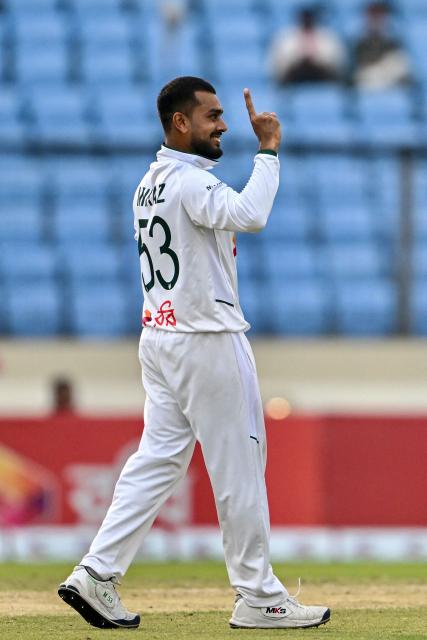 Bangladesh's Mehidy Hasan Miraz celebrates after taking the wicket of Pakistan's Shaheen Shah Afridi during the third day of the first Test cricket match between Bangladesh and Pakistan at the Sher-e-Bangla National Stadium in Mirpur on May 10, 2026. (Photo by Munir UZ ZAMAN / AFP)