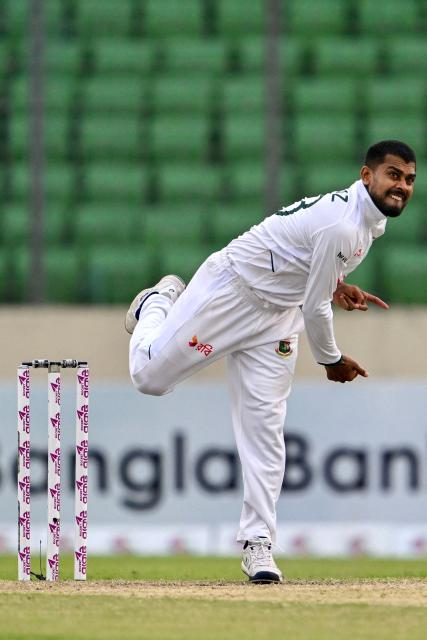 Bangladesh's Mehidy Hasan Miraz delivers a ball during the third day of the first Test cricket match between Bangladesh and Pakistan at the Sher-e-Bangla National Stadium in Mirpur on May 10, 2026. (Photo by Munir UZ ZAMAN / AFP)
