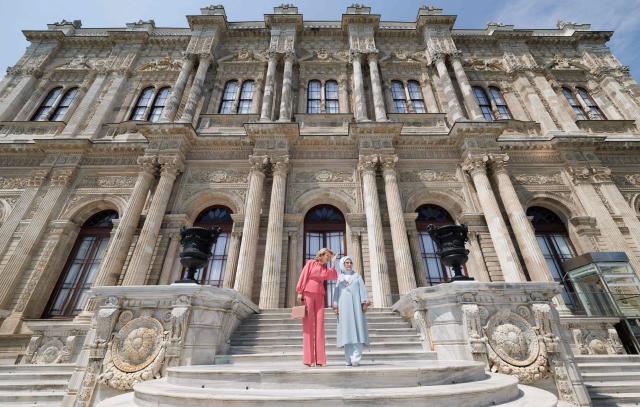 Queen Mathilde of Belgium (L) and Turkey's First Lady Emine Erdogan (R) meet on the steps of the Dolmabahçe Palace on the first day of a Belgian economic mission to Turkey, in Istanbul on May 10, 2026. Queen Mathilde is visiting Turkey from May 10 to May 14, 2026. (Photo by Benoit DOPPAGNE / Belga / AFP) / Belgium OUT