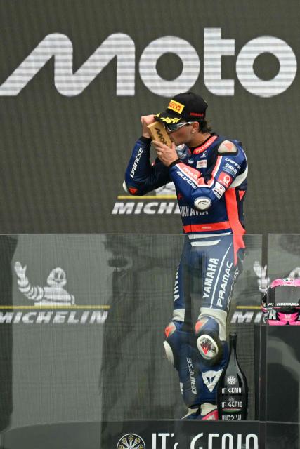 Blu Cru Pramac Yamaha Moto2's Spanish rider Izan Guevara celebrates on the podium after winning the Moto2 race as part of the Moto GP Grand Prix of France weekend at Le Mans, northwestern France, on May 10, 2026. (Photo by Loic VENANCE / AFP)