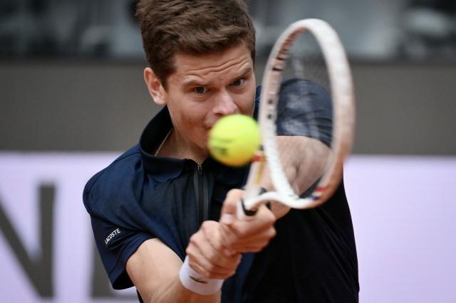Belgium's Alexander Blockx hits a return to Germany's Alexander Zverev during their men's singles match at the WTA Rome Open tennis tournament at Foro Italico in Rome on May 10, 2026. (Photo by Alberto PIZZOLI / AFP)