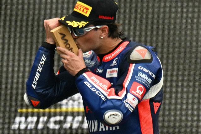 Blu Cru Pramac Yamaha Moto2's Spanish rider Izan Guevara celebrates on the podium after winning the Moto2 race as part of the Moto GP Grand Prix of France weekend at Le Mans, northwestern France, on May 10, 2026. (Photo by Loic VENANCE / AFP)