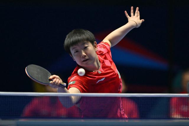 China's Sun Yingsha returns against Japan's Hina Hayata during their Women's Teams final match at the ITTF World Table Tennis Championships in Wembley Arena, west London on May 10, 2026. (Photo by Glyn KIRK / AFP)